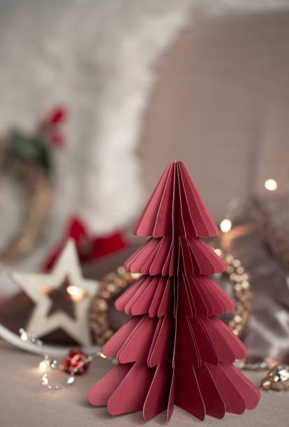 istock Close-up of a decorative cardboard Christmas tree on a blurred background. 1420980137