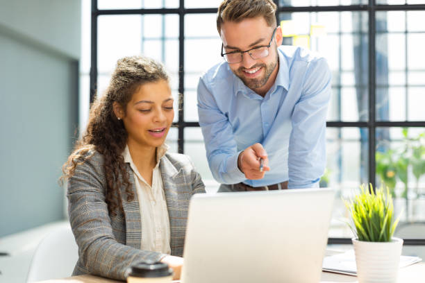 istock Two collegues discussing documents and other working moments in office. 1420982194