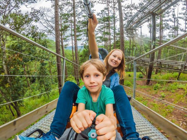 istock Mother and son on the alpine coaster 1420982412