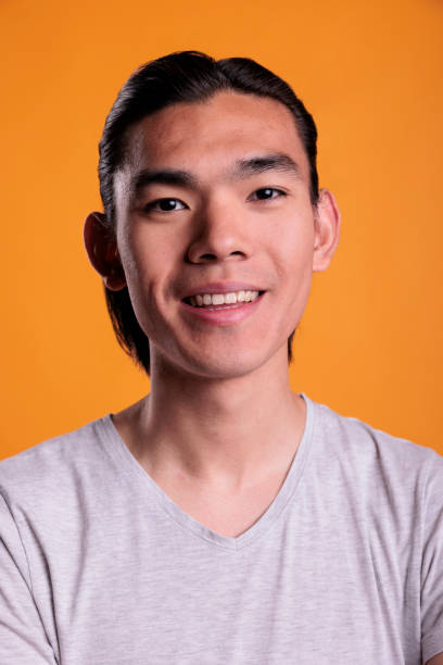 istock Young smiling asian man portrait closeup 1420983595