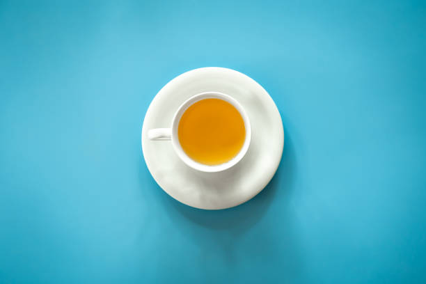 istock Cup of tea on blue background isolated, flat lay. 1420983632
