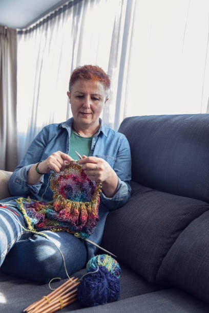 istock Mature Woman Knitting Wool 1420985242