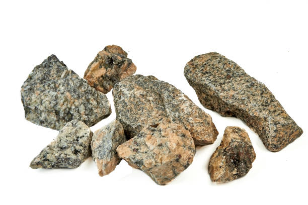 istock A bunch of textured stones on a white background 1420987112