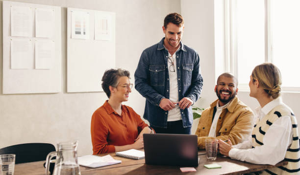 istock Happy designers having a meeting in an office 1420989493