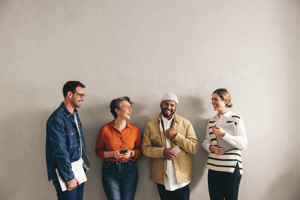 istock Happy businesspeople standing in a waiting area 1420989795
