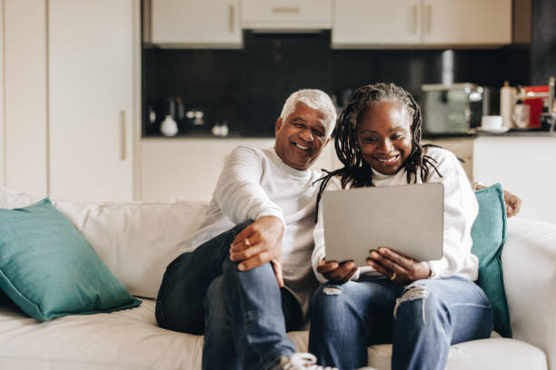 istock Happy mature couple having a video call on a digital tablet 1420991568