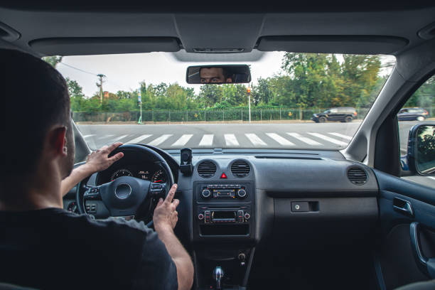 istock Hands on the wheel when driving at high speed from inside the car. 1420991729