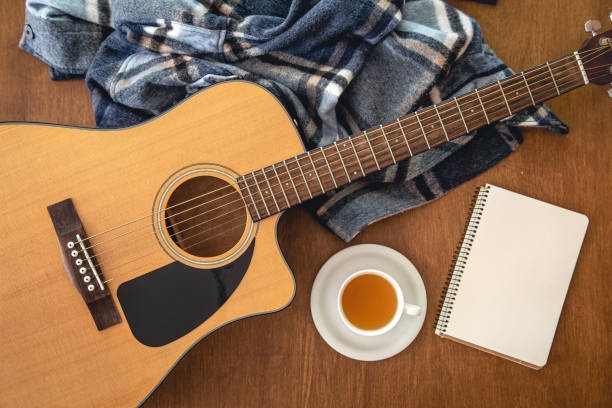 istock Music background with acoustic guitar, top view. 1420992588