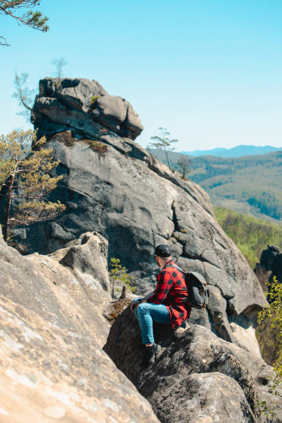 istock man hiker with backpack at dovbush rocks 1420999269