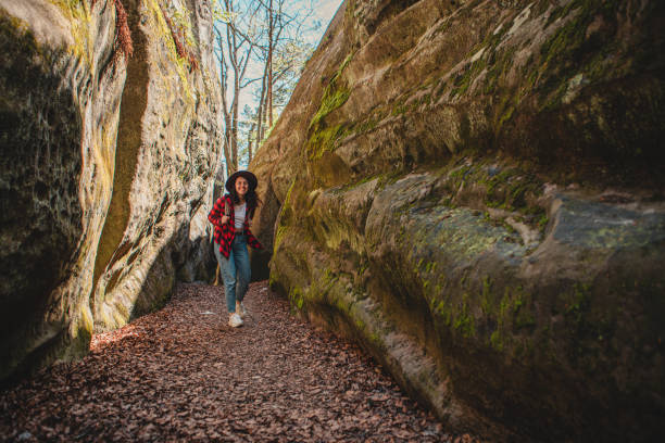 istock woman hiker with backpack walking by trail 1420999282