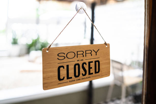 Close sign broad through the door glass. CLOSED sign board through the glass of store window. closed we are sorry text wooden board  door vintage shop sign close store. Close sign broad through the door glass. CLOSED sign board through the glass of store window. closed we are sorry text wooden board  door vintage shop sign close store. closing stock pictures, royalty-free photos & images