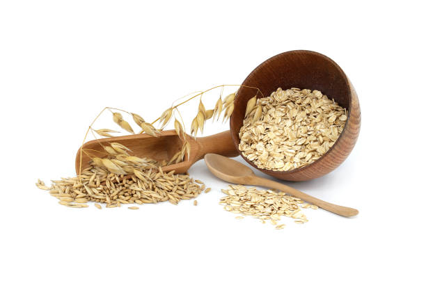 istock Oats grains and oat groats rolled into flakes 1421007347