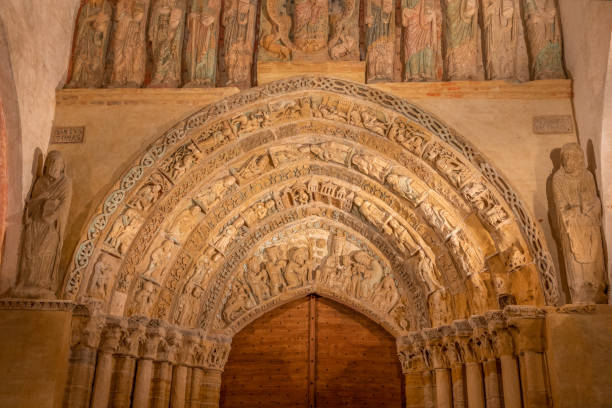 tympanum of the church in mimizan, a world heritage in france - mimizan imagens e fotografias de stock