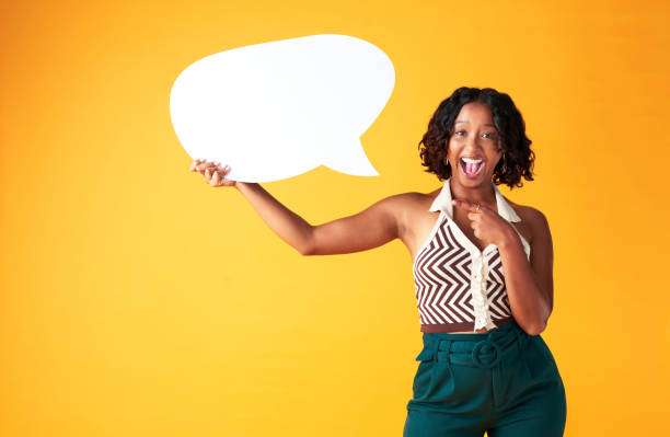 istock Speech bubble, blank billboard and advertising poster with woman thinking an idea or opinion. Review, say and voice of people in public news add, good comments for social media in studio mockup 1421009708