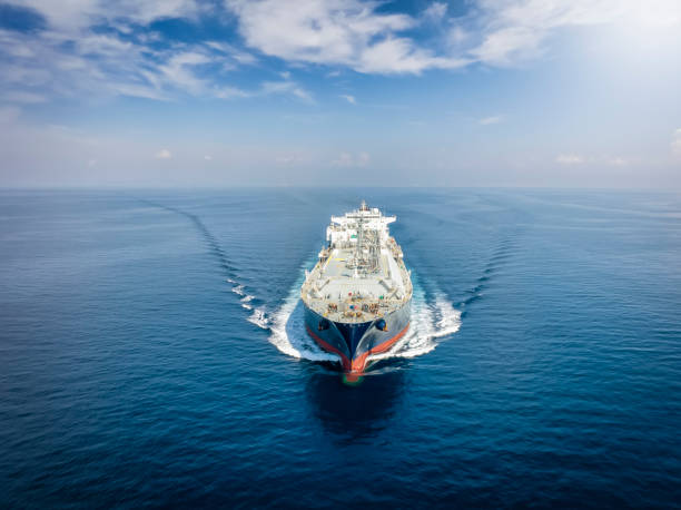 Front view of a large LNG or liquid gas tanker vessel Front view of a large LNG or liquid gas tanker vessel traveling with high speed over blue ocean liquefied natural gas stock pictures, royalty-free photos & images