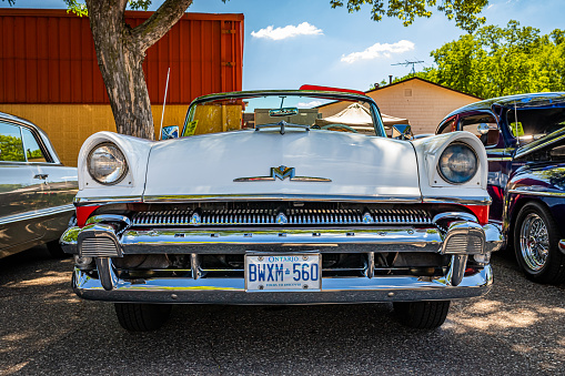 Falcon Heights, MN - June 17, 2022: Low perspective front view of a 1956 Mercury Montclair Convertible at a local car show.