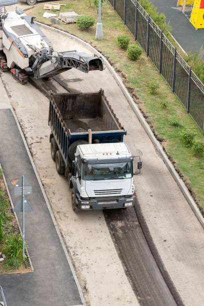 istock Asphalt milling machine working on the street. 1421010910