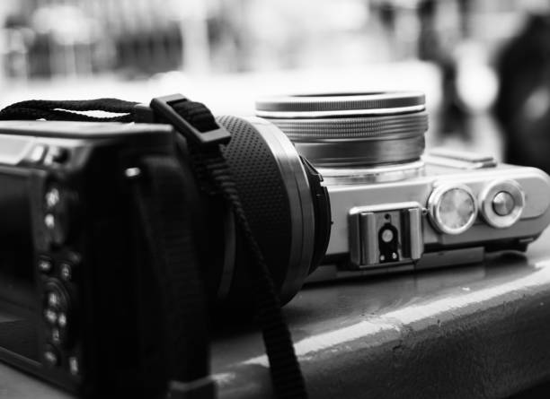 istock Close up of cameras on table 1421012201