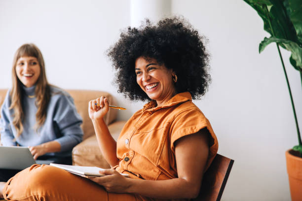istock Businesswoman smiling happily while sitting in a meeting 1421013309