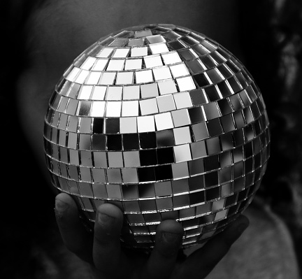 Cropped hand holding disco ball