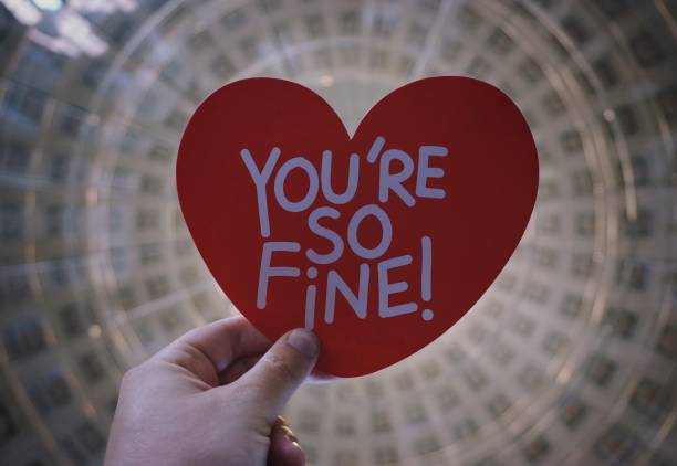istock Cropped hand holding paper heart 1421015797