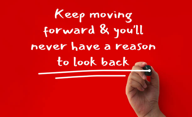 istock Keep moving forward and you will never have a reason to look back text written on red cover background. Inspirational concept 1421018263