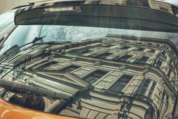 istock Reflection of building in car window 1421020327