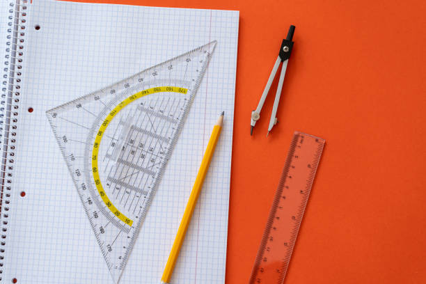 istock Ruler and pencil at open notepad. Accessories for learning mathematics. Education, Back to school concept 1421021999