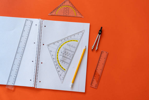 istock Ruler and pencil at open notepad. Accessories for learning mathematics. Education, Back to school concept 1421022000