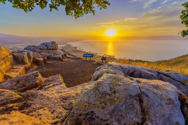 Sunrise view of the Sea of Galilee, from Mount Arbel (west side). Northern Israel. Text on sign: Sea of Galilee Lookout