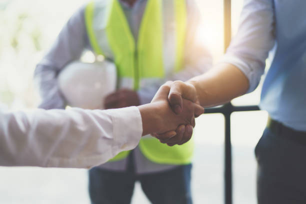 istock Meeting and greeting, Two engineer or architect meeting for project, handshake after consultation and conference new project plan, contract for both companies, success, partnership 1421028269