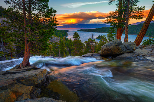 Sunset above Lower Eagle Falls with Emerald Bay in the background, Lake Tahoe, California.