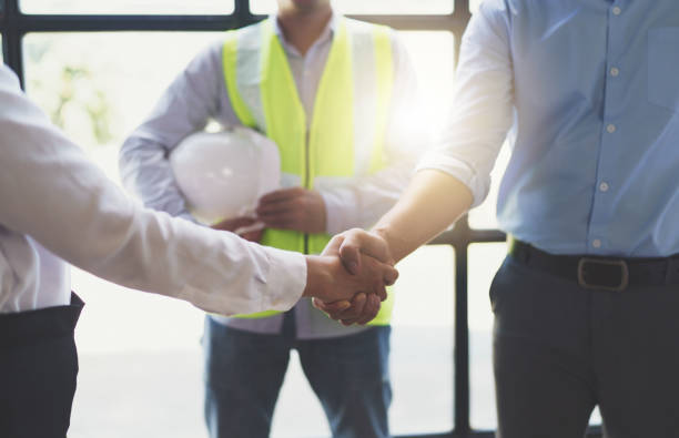 istock Meeting and greeting, Two engineer or architect meeting for project, handshake after consultation and conference new project plan, contract for both companies, success, partnership 1421028840