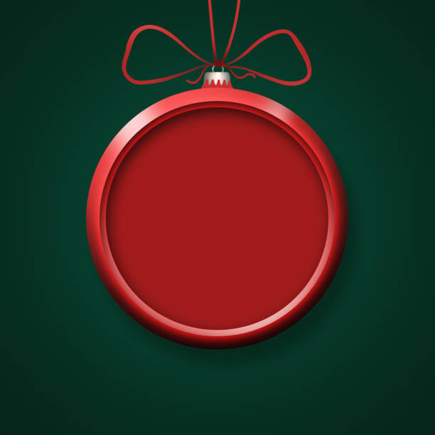 istock Red Christmas ornament on green background 1421032060