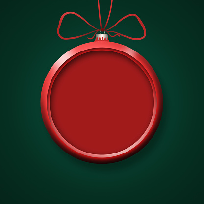 Red Christmas ornament on green background
