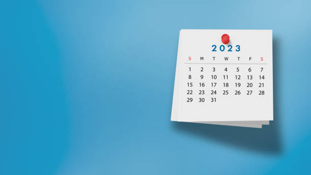 istock 2023 Calendar on Note Pad Against Blue Background 1421036299