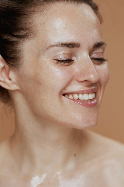istock happy modern woman with wet face washing 1421036383
