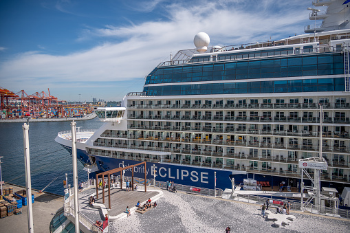 Vancouver, British Columbia, Canada - July 24, 2022: Cruise ship Celebrity Eclipse docked at Canada Place in the Port of Vancouver during peak cruise ship season.