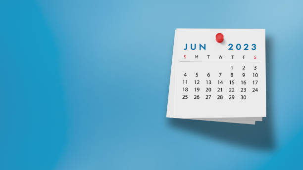2023 June Calendar on Note Pad Against Blue Background 2023 June calendar on a white note paper pinned on wall against blue background. High resolution and copy space for all your crop needs. june stock pictures, royalty-free photos & images