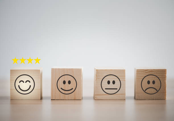 istock emotion faces on wooden cubes arranged on table for satisfaction survey 1421037920