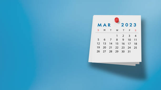 istock 2023 March Calendar on Note Pad Against Blue Background 1421037979