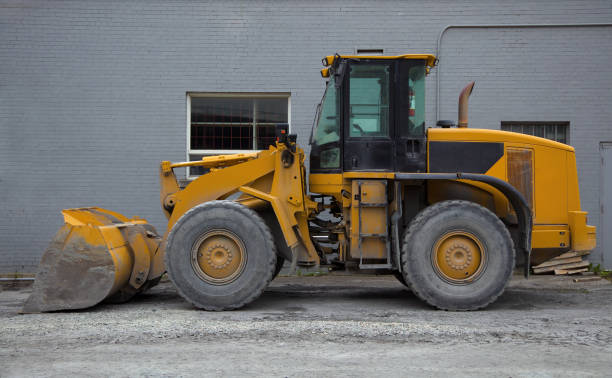 istock tractor loader on construction site heavy duty yellow hydraulic equipment 1421039054