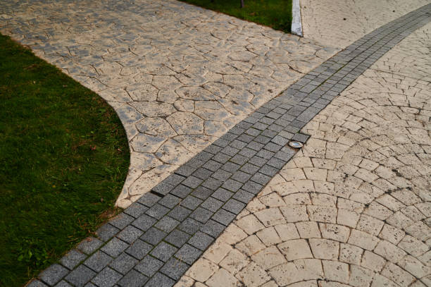 istock stone walkway in landscape design surrounded by green grass and trees 1421039820