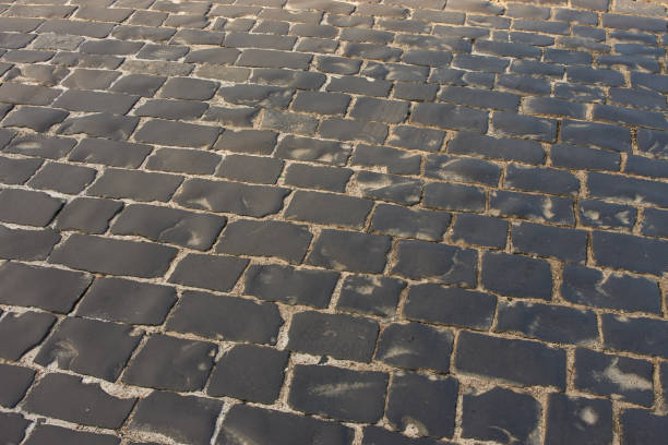 istock paved road of rough old stone, paving stones 1421039896