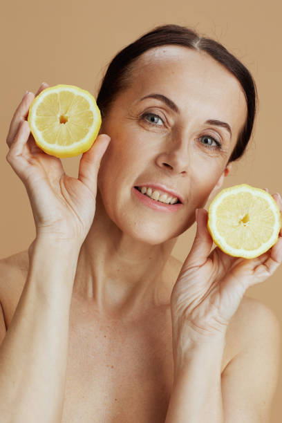 istock happy modern woman against beige background 1421040898
