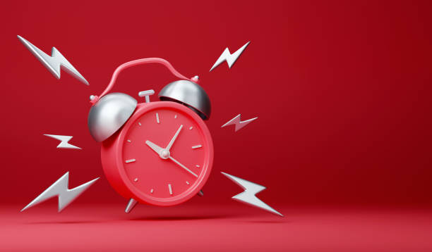 istock Red vintage ringing alarm clock with silver lightings 1421041496