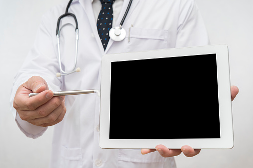 Medical doctor or physician consulting patient's health online using digital tablet, Online medical health or medical network concept. Can insert text, images for advertising purposes