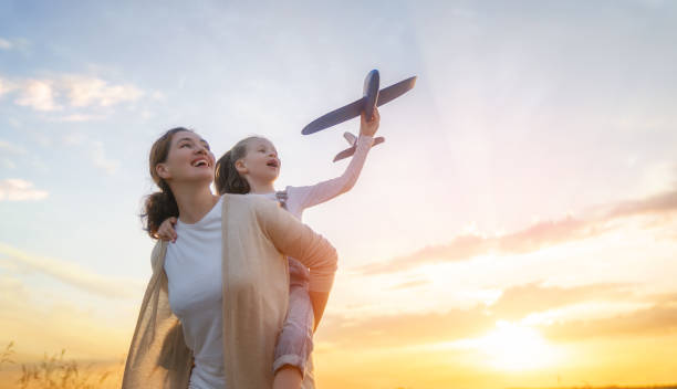 istock Happy family at sunset 1421049559