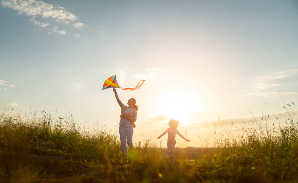 istock Happy family at sunset 1421049582