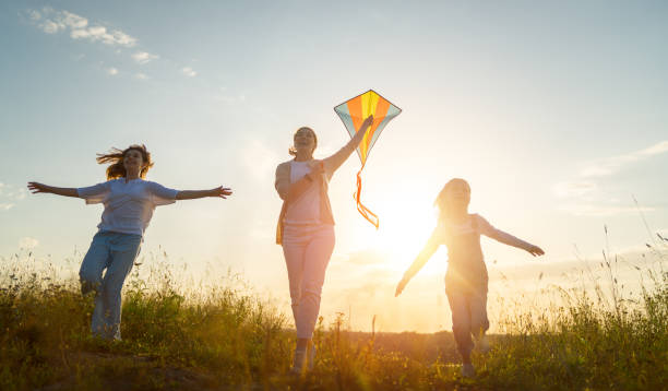 istock Happy family at sunset 1421049593
